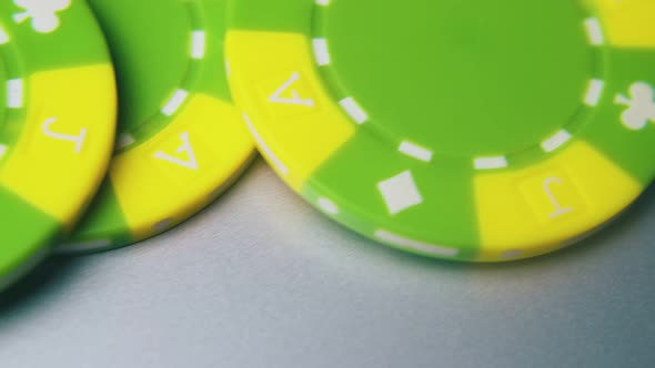 Casino Chips and Joker Playing Card on Light Grey Background