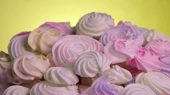 Swirls of Sweet Meringue Rotating on Yellow Background