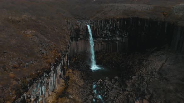 Aerial View of the Svartifoss Waterfall Surrounded By Basalt Columns in Iceland