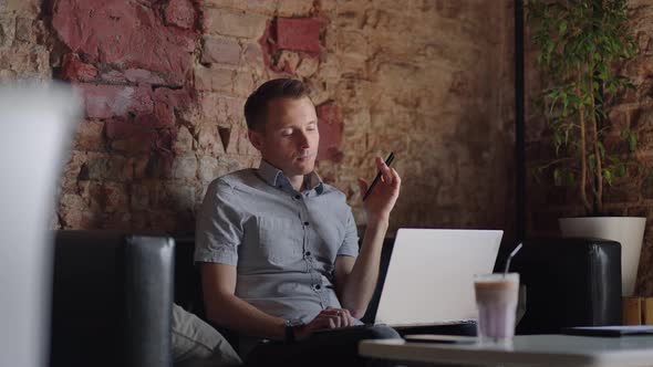 Thoughtful Serious Young Man Student Writer Sit at Home Office Desk with Laptop Thinking of