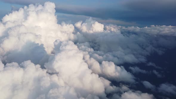 View of Clouds and the Solar Sky From Above From the Plane. Clouds in the Window Plane. The View