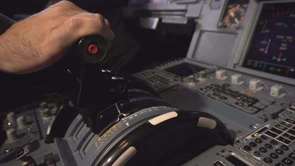 The Cockpit of the Aircraft. The Pilot Adjusts the Autopilot