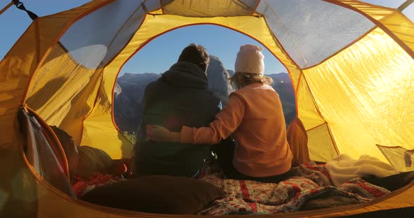 Lovers Cuddle in a Tent at the Background of the Symbol of Yosemite National Park,the Half Dome Rock