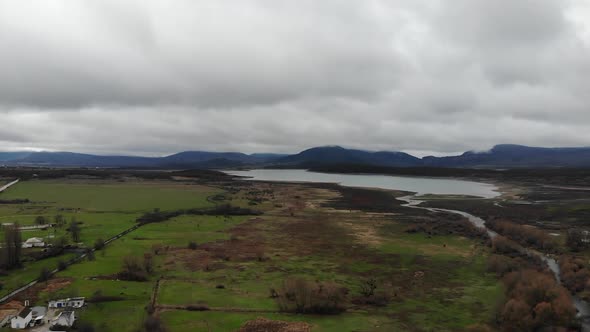 Village on Plateau on Cloudy Sky Landscape From Landing Flying Drone