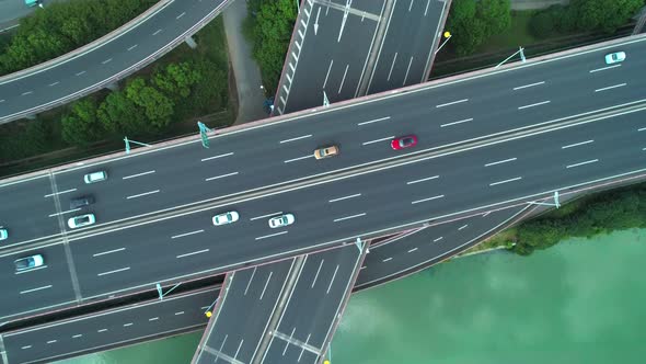 Aerial Drone Top Down View of Highway Multilevel Junction Road with Moving Cars at Daytime