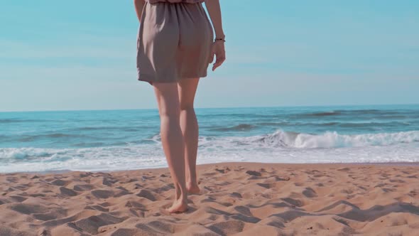 Woman Walking To the Summer Beach During Holidays Travel