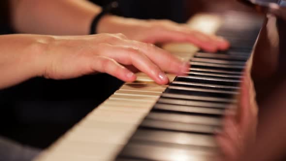 Woman Playing on Vintage Wooden Piano