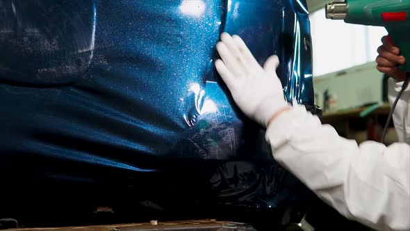 Worker at the Service Station is Further Processed Edge Vinyl Special Dryer