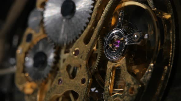 Moving Metal Gears Inside Working Watch Mechanism. Close Up