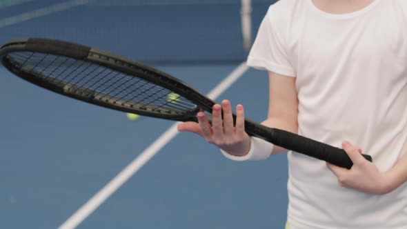 Kid Holding Tennis Racket On Court