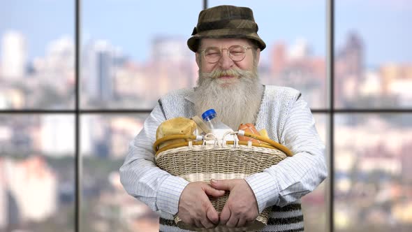 Senior Man Holding Basket with Dairy Products