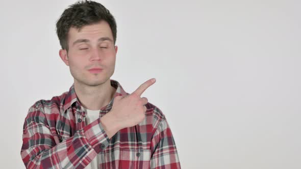 Portrait of Young Man Pointing Towards Product