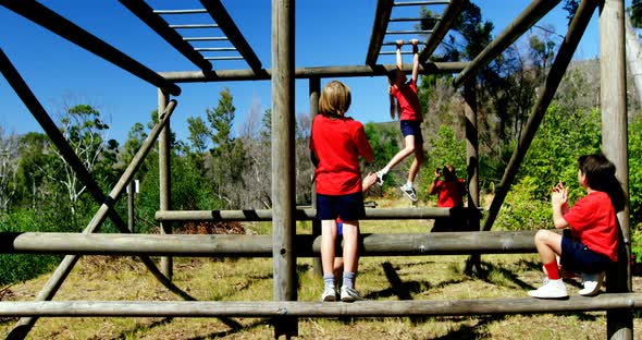 Trainer training kids in the boot camp