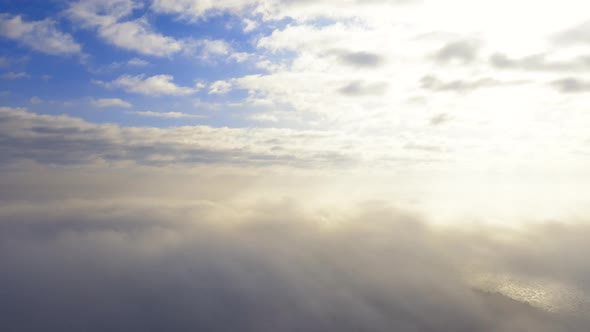 Time lapse beautiful sky with clouds at the sunrise, Flight through the moving cloudscape