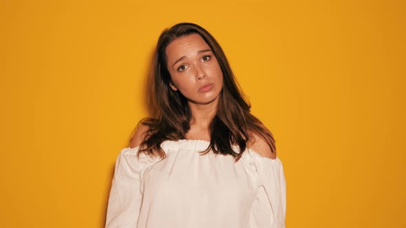 Portrait of beautiful annoyed upset teenager girl standing with folded crossed arms