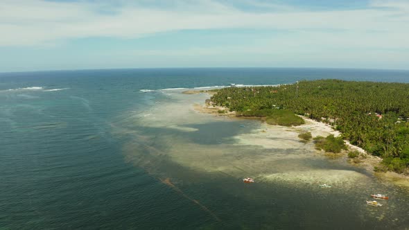 The Coast of Siargao Island, Blue Ocean and Waves.