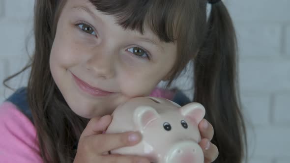 Girl with piggy bank. 