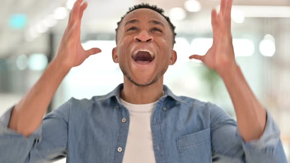 Portrait of Angry Casual African Man Shouting, Screaming