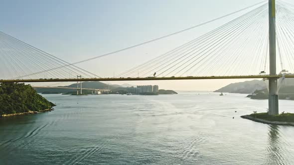 Cars crossing Ting Kau Bridge in Tsuen Wan, Hong Kong; aerial push-in