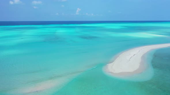 Beautiful above island view of a sandy white paradise beach and aqua blue water background in hi res