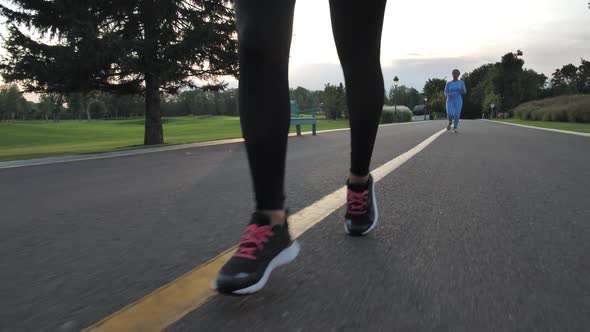 Legs of Female Runner During Outdoor Training