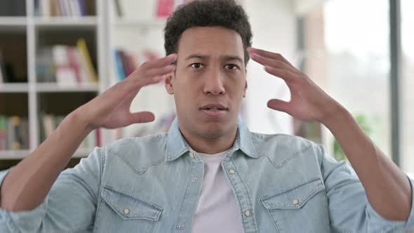 Saddened Young African American Man Reacting To Loss