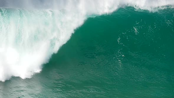 Huge Foamy Turquoise Wave Rolling the Surface of the Ocean. The Coast of Atlantic Ocean in Portugal