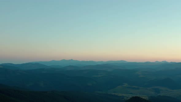 Aerial Drone View a Beautiful Evening in the Mountains with the Moon. Wide Shot V2