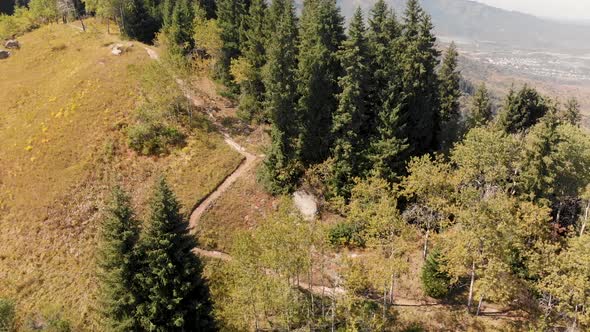 Hiker with Backpack Walking in the Mountains