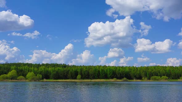 Clouds Are Reflected in Smooth Water of Lake