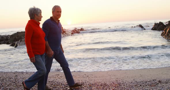 Senior Couple Walking Hand in Hand in The Beach 4k