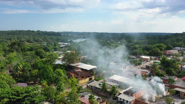 Aerial - Impoverished indigenous slum near the city of Manaus, Brazil. Wide shot, pull back.