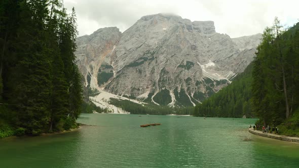 aerial over lago di braies lake in Dolomites mountain range, Italy