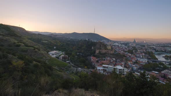 Beautyful cityscape of capital of Georgia. Time lapse shot of Tbilisi city at sunset.