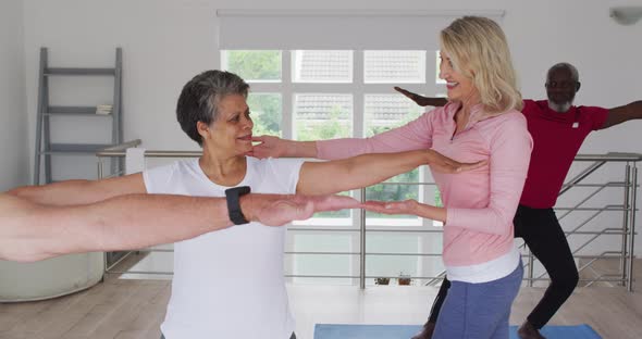 Diverse group of seniors taking part in fitness class
