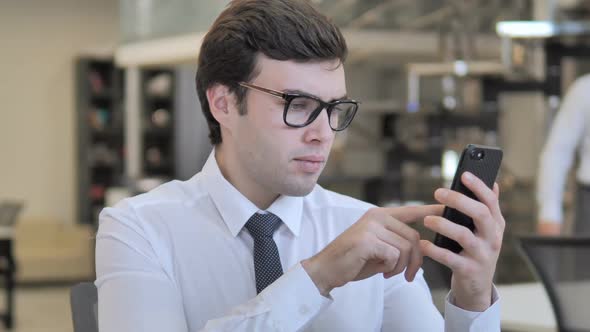 Businessman Using Smartphone Typing Message