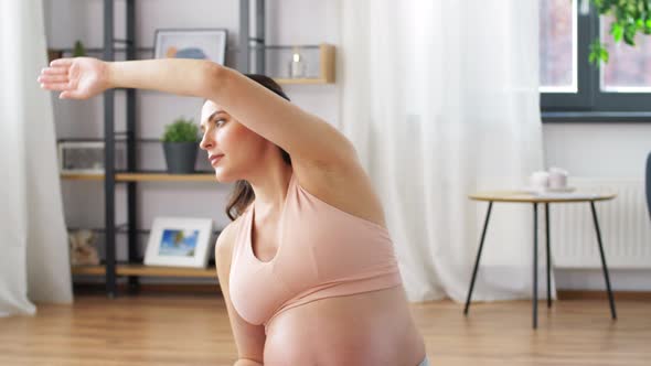 Happy Pregnant Woman Doing Sports at Home