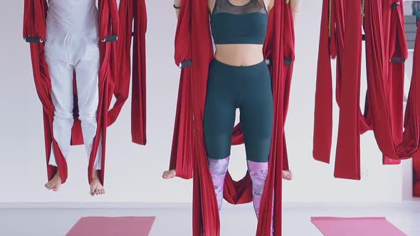 Ladies Group Legs Standing on Special Fly Yoga Hammocks