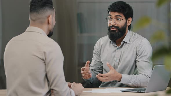 Two Multiracial Arabic Hispanic Colleagues Businesspeople Men Discuss Startup Accept Common Project