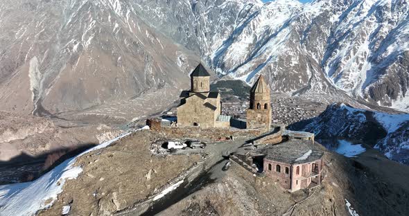 Aerial view of Gergeti Trinity Church, Tsminda Sameba in Kazbegi. Georgia 2022