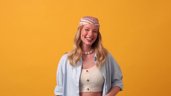 Smiling blonde woman hippie winking at the camera