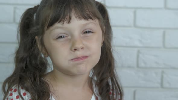 Child eat vitamines in orange. 