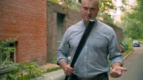 Hooligan Clapping a Hand with A Baseball Bat