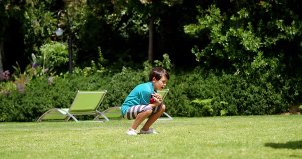 Father and son playing cricket