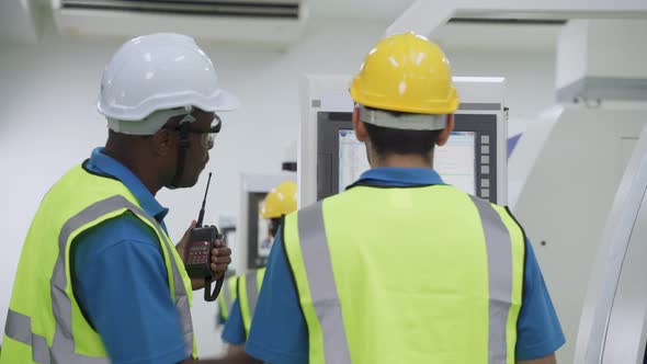 Group of diversity worker people wearing protective safety helmet and glasses in industry factory.