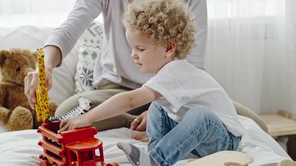 Angelic Little Baby Playing with Toys alt