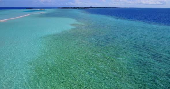 Tropical birds eye abstract shot of a paradise sunny white sand beach and blue sea background in col