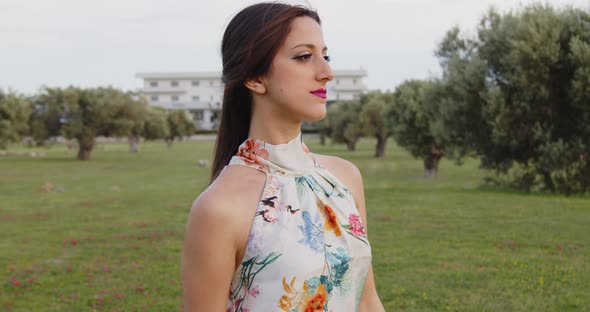 Model with long white dress with flowers