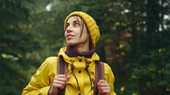 Portrait Tourist Woman in Yellow Jacket at Forest Standing Looking Around Inspiring Fall Weather