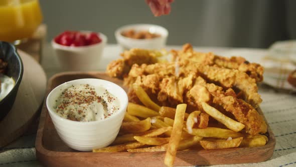 Pouring Salt on French Fries